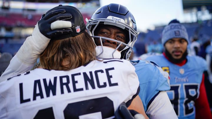 Tennessee Titans linebacker Arden Key (49) congratulates Jacksonville Jaguars quarterback Trevor Lawrence (16) after the game at Nissan Stadium in Nashville, Tenn., Sunday, Nov. 30, 2025.