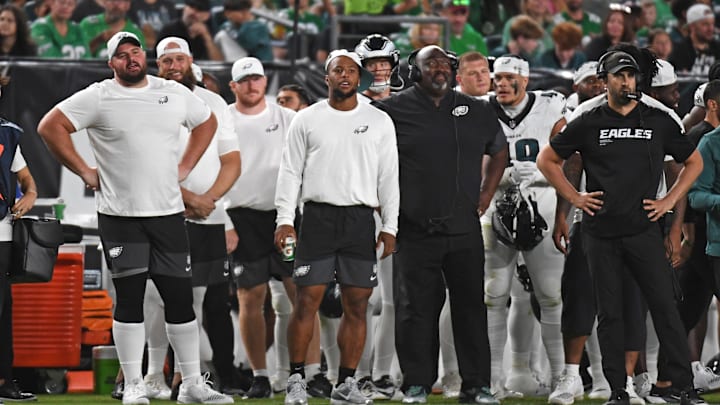 Aug 7, 2025; Philadelphia, Pennsylvania, USA; Philadelphia Eagles guard Landon Dickerson (69), running back Saquon Barkley (26) and head coach Nick Sirianni on the sidelines against the Cincinnati Bengals during the second quarter at Lincoln Financial Field. Mandatory Credit: Eric Hartline-Imagn Images