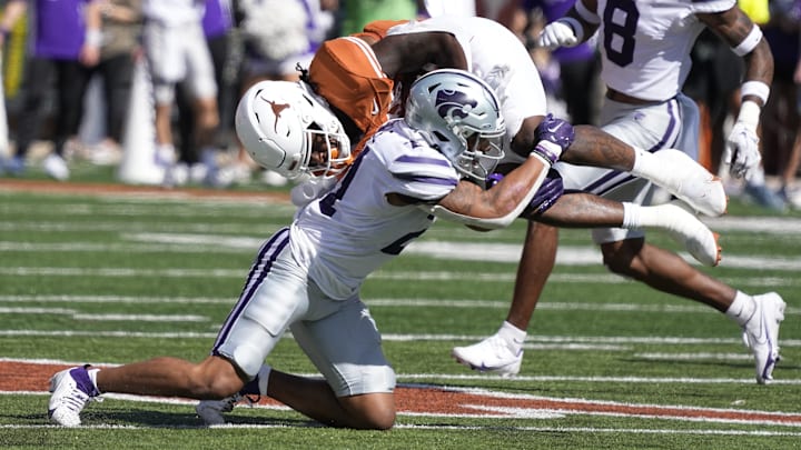 Nov 4, 2023; Austin, Texas, USA; Kansas State Wildcats defensive back Marques Sigle (21) tackles Texas Longhorns running back Jonathon Brooks (24) during the second half at Darrell K Royal-Texas Memorial Stadium. Mandatory Credit: Scott Wachter-USA TODAY Sports