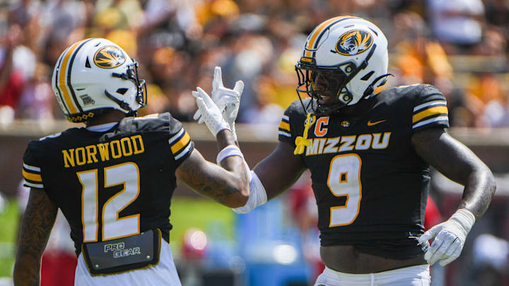 Sept 13, 2025; Columbia, Missouri, USA; Missouri Tigers cornerback Drey Norwood and defensive end Zion Young celebrate a play in the second quarter at Faurot Field. Sept 13, 2025; Columbia, Missouri, USA; Missouri Tigers cornerback Drey Norwood and defensive end Zion Young celebrate a play in the second quarter at Faurot Field.