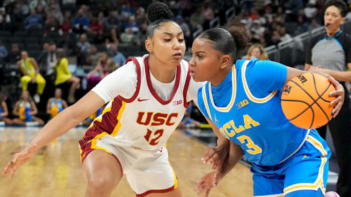 USC Trojans guard JuJu Watkins (12) guards UCLA Bruins guard Londynn Jones (3) during the first half of the 2025 TIAA Big Ten Women's Basketball Tournament final game on Sunday, March 9, 2025, at Gainbridge Fieldhouse in Indianapolis. UCLA defeated USC 72-67.