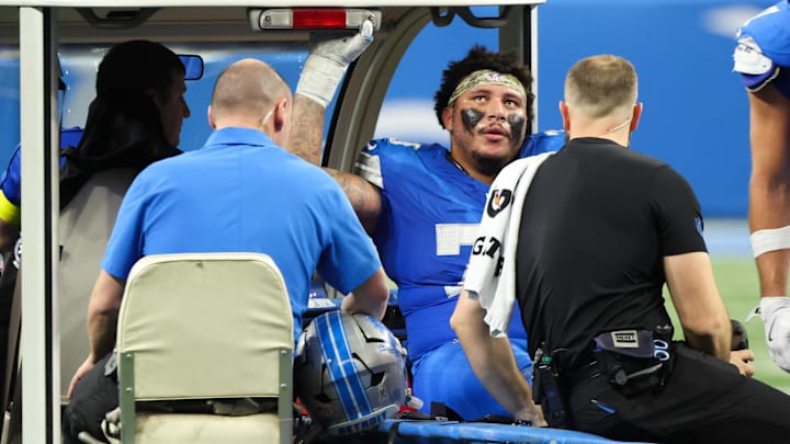 Detroit Lions offensive lineman Christian Mahogany (73) is helped off the field after an injury in the fourth quarter against the Minnesota Vikings at Ford Field. Detroit Lions offensive lineman Christian Mahogany (73) is helped off the field after an injury in the fourth quarter against the Minnesota Vikings at Ford Field.