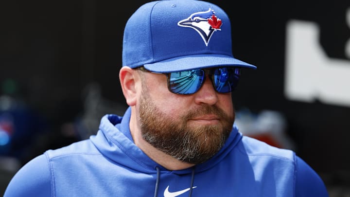 Apr 3, 2026; Chicago, Illinois, USA; Toronto Blue Jays manager John Schneider looks on from the dugout before a baseball game against the Chicago White Sox at Rate Field. 