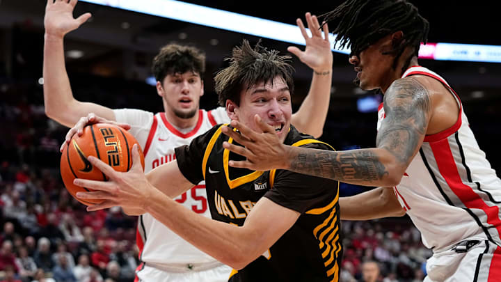 Ohio State Buckeyes forward Devin Royal (21) defends Valparaiso Beacons forward Cooper Schwieger (13) during the during the first half of the NCAA men's basketball game at Value City Arena in Columbus on Dec. 17, 2024.