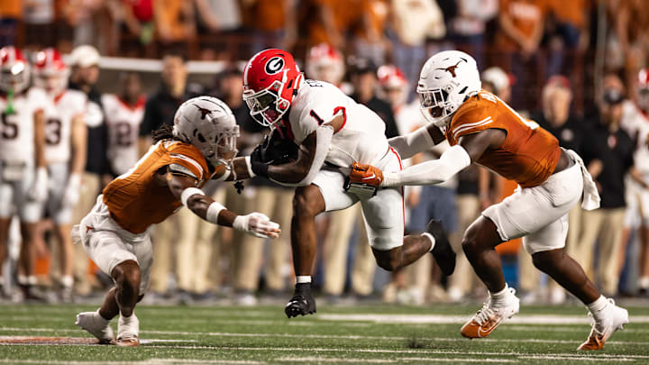 Oct 19, 2024; Austin, Texas, USA; Georgia Bulldogs running back Trevor Etienne (1) runs the ball against the Texas Longhorns during the first half at Darrell K Royal-Texas Memorial Stadium. Mandatory Credit: Brett Patzke-Imagn Images