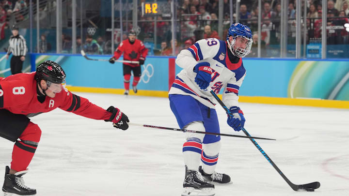 Feb 22, 2026; Milan, Italy; Brock Nelson (29) of the United States is defended by Cale Makar (8) of Canada in the men's ice hockey gold medal game during the Milano Cortina 2026 Olympic Winter Games at Milano Santagiulia Ice Hockey Arena. Mandatory Credit: Amber Searls-Imagn Images Feb 22, 2026; Milan, Italy; Brock Nelson (29) of the United States is defended by Cale Makar (8) of Canada in the men's ice hockey gold medal game during the Milano Cortina 2026 Olympic Winter Games at Milano Santagiulia Ice Hockey Arena. Mandatory Credit: Amber Searls-Imagn Images
