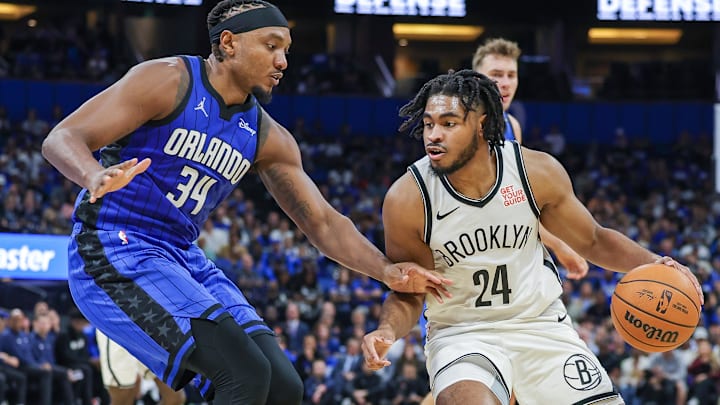 Oct 25, 2024; Orlando, Florida, USA; Orlando Magic center Wendell Carter Jr. (34) defends Brooklyn Nets guard Cam Thomas (24) during the second quarter at Kia Center. Mandatory Credit: Mike Watters-Imagn Images