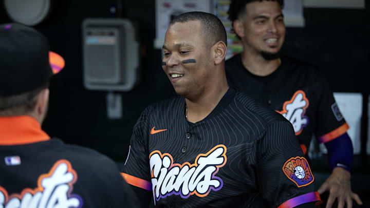 Jun 17, 2025; San Francisco, California, USA; San Francisco Giants designated hitter Rafael Devers (16) greets his new teammates in the dugout before taking on the Cleveland Guardians during the first inning at Oracle Park. 
