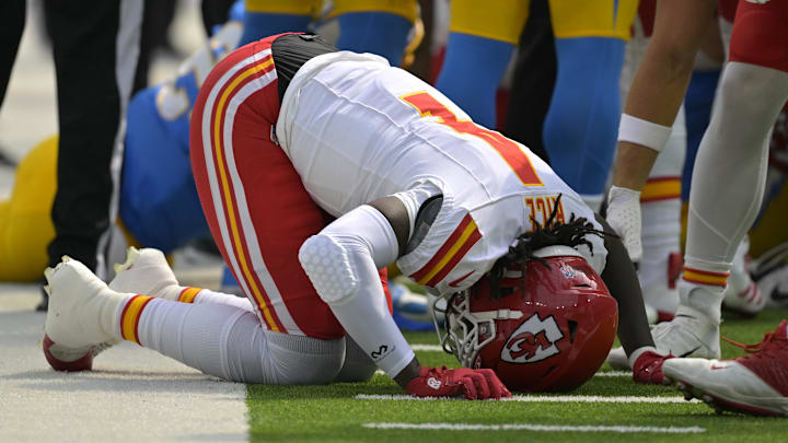 Sep 29, 2024; Inglewood, California, USA; Kansas City Chiefs wide receiver Rashee Rice (4) pounds his fist on the ground after an injury in the first half against the Los Angeles Chargers at SoFi Stadium. Mandatory Credit: Jayne Kamin-Oncea-Imagn Images Sep 29, 2024; Inglewood, California, USA; Kansas City Chiefs wide receiver Rashee Rice (4) pounds his fist on the ground after an injury in the first half against the Los Angeles Chargers at SoFi Stadium. Mandatory Credit: Jayne Kamin-Oncea-Imagn Images