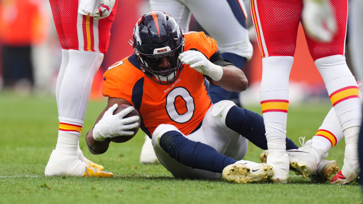 Oct 29, 2023; Denver, Colorado, USA; Denver Broncos linebacker Jonathon Cooper (0) following his fumble recovery in the second quarter against the Kansas City Chiefs at Empower Field at Mile High. Mandatory Credit: Ron Chenoy-USA TODAY Sports