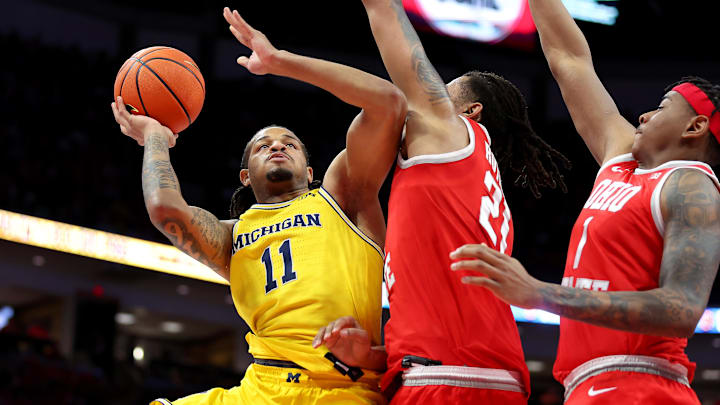 Feb 8, 2026; Columbus, Ohio, USA;  Michigan Wolverines guard Roddy Gayle Jr. (11) drives to the basket as Ohio State Buckeyes forward Devin Royal (21) defends during the first half at Value City Arena. Mandatory Credit: Joseph Maiorana-Imagn Images
