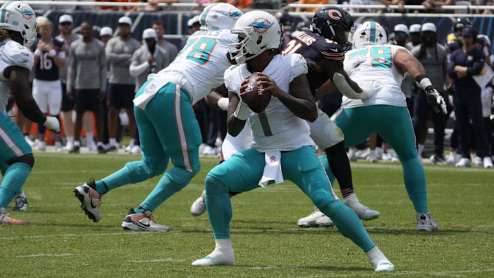 Miami Dolphins quarterback Tua Tagovailoa (1) looks to pass the ball against the Chicago Bears during the first half at Soldier Field. Miami Dolphins quarterback Tua Tagovailoa (1) looks to pass the ball against the Chicago Bears during the first half at Soldier Field.