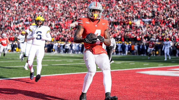 Ohio State wide receiver Jeremiah Smith makes a catch for a touchdown against Michigan during the first half at Ohio Stadium in Columbus, Ohio on Saturday, Nov. 30, 2024. Ohio State wide receiver Jeremiah Smith makes a catch for a touchdown against Michigan during the first half at Ohio Stadium in Columbus, Ohio on Saturday, Nov. 30, 2024.