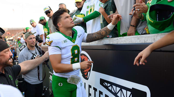 Sep 14, 2024; Corvallis, Oregon, USA; Oregon Ducks quarterback Dillon Gabriel (8) greets fans after the game against the Oregon State Beavers at Reser Stadium. Mandatory Credit: Craig Strobeck-Imagn Images