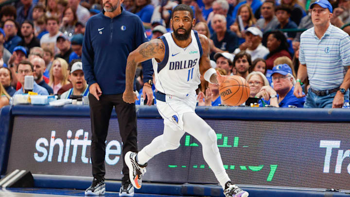 Apr 7, 2024; Dallas, Texas, USA; Dallas Mavericks guard Kyrie Irving (11) brings the ball up on a