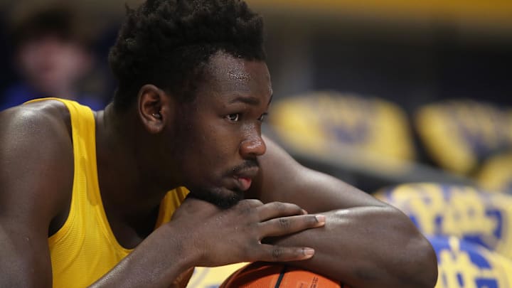 Feb 15, 2025; Pittsburgh, Pennsylvania, USA; Pittsburgh Panthers forward Papa Amadou Kante (4) looks on during warm ups before the game against the Miami (Fl) Hurricanes at the Petersen Events Center. Mandatory Credit: Charles LeClaire-Imagn Images Feb 15, 2025; Pittsburgh, Pennsylvania, USA; Pittsburgh Panthers forward Papa Amadou Kante (4) looks on during warm ups before the game against the Miami (Fl) Hurricanes at the Petersen Events Center. Mandatory Credit: Charles LeClaire-Imagn Images