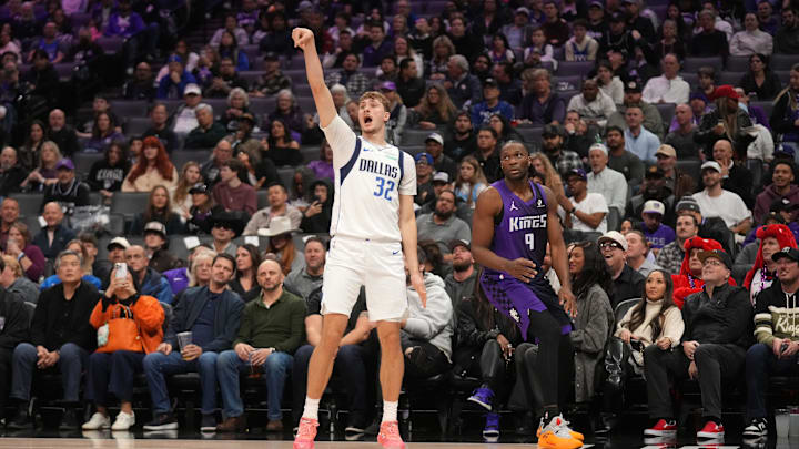 Jan 6, 2026; Sacramento, California, USA; Dallas Mavericks forward Cooper Flagg (32) reacts after missing a shot next to Sacramento Kings forward Precious Achiuwa (9) in the second quarter at the Golden 1 Center. Mandatory Credit: Cary Edmondson-Imagn Images