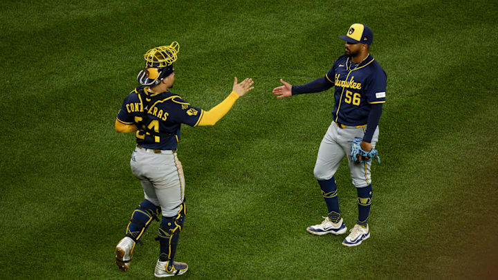 Jul 21, 2025; Seattle, Washington, USA; Milwaukee Brewers pitcher Grant Anderson (56) shakes hands with catcher William Contreras (24) following a victory against the Seattle Mariners at T-Mobile Park. Mandatory Credit: Joe Nicholson-Imagn Images