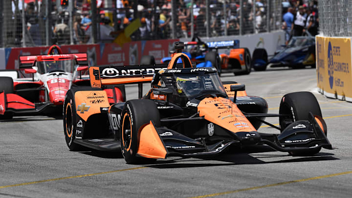 Jul 20, 2025; Toronto, Ontario, CAN;  Indycar driver Pato O'Ward (5) leads the field as he drives to victory during the Ontario Honda Dealers Indy at Streets of Toronto. Mandatory Credit: Dan Hamilton-Imagn Images