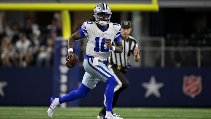  Dallas Cowboys quarterback Joe Milton III runs with the ball during the game.