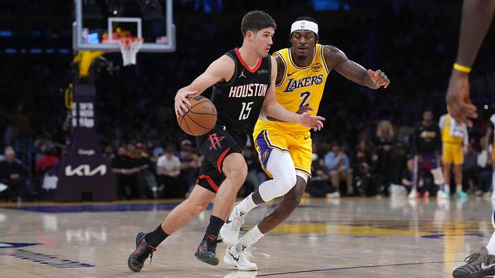 Apr 18, 2026; Los Angeles, California, USA; Houston Rockets guard Reed Sheppard (15) dribbles the ball against Los Angeles Lakers forward Jarred Vanderbilt (2) in the second half during game one of the first round of the 2026 NBA Playoffs at Crypto.com Arena. Mandatory Credit: Kirby Lee-Imagn Images