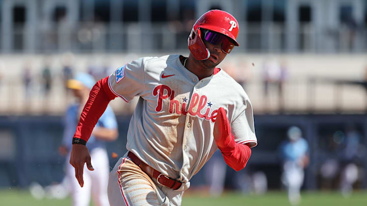 Feb 25, 2025; Port Charlotte, Florida, USA;  Philadelphia Phillies outfielder Justin Crawford (80) runs home to score against the Tampa Bay Rays during the fourth inning at Charlotte Sports Park.