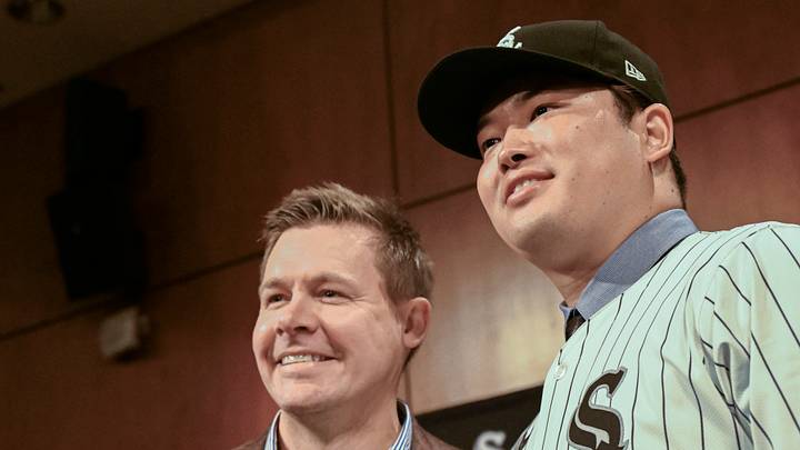 Dec 22, 2025; Chicago, Il, USA;  New Chicago White Sox player Munetaka Murakami, right, dons his hat with General Manager Chris Getz, left,  during a press conference  where he was introduced at Rate Field. Mandatory Credit: Matt Marton-Imagn Images