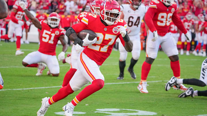 Sep 15, 2024; Kansas City, Missouri, USA; Kansas City Chiefs safety Chamarri Conner (27) recovers a fumble and runs in for a touchdown against the Cincinnati Bengals during the second half at GEHA Field at Arrowhead Stadium. Mandatory Credit: Denny Medley-Imagn Images