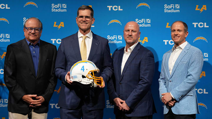 Chargers owner Dean Spanos, head coach Jim Harbaugh, GM Joe Hortiz and president of football operations John Spanos. 