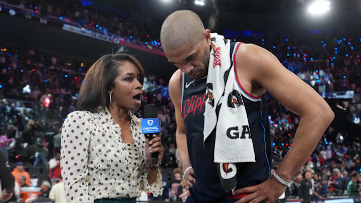 May 1, 2025; Inglewood, California, USA; FanDuel Sports Network reporter Kristina Pink interviews LA Clippers forward Nicolas Batum (33) after game six of first round for the 2025 NBA Playoffs against the Denver Nuggets at Intuit Dome. Mandatory Credit: Kirby Lee-Imagn Images