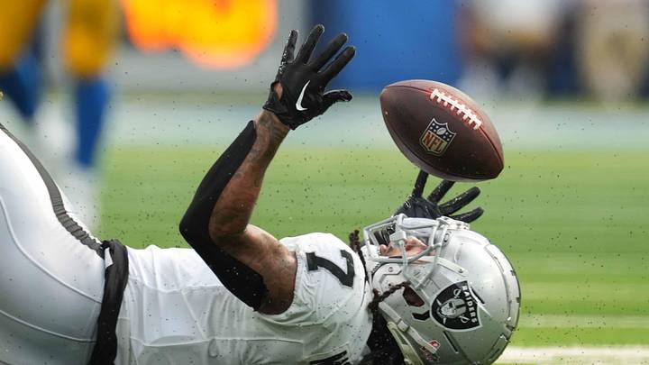 Sep 8, 2024; Inglewood, California, USA; Las Vegas Raiders safety Tre'von Moehrig (7) attempts to intercept a pass against the Los Angeles Chargers in the second half at SoFi Stadium. Mandatory Credit: Kirby Lee-Imagn Images
