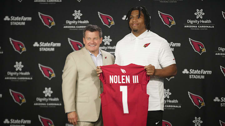 Cardinals defensive lineman Walter Nolen stands and holds his jersey with owner Michael Bidwill (left) during his introductory news conference inside the Arizona Cardinals training facility on April 25, 2025, in Tempe. Cardinals defensive lineman Walter Nolen stands and holds his jersey with owner Michael Bidwill (left) during his introductory news conference inside the Arizona Cardinals training facility on April 25, 2025, in Tempe.