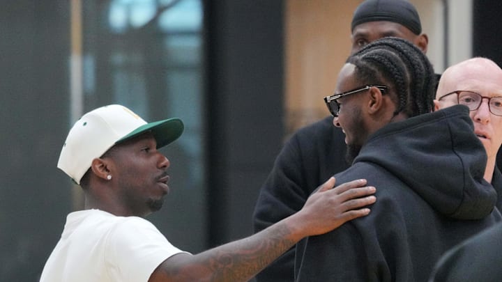 Jul 2, 2024; El Segundo, CA, USA; Sports agent Rich Paul (left) greets Los Angeles Lakers second round draft pick Bronny James (right) as father LeBron James watches at a press conference at the UCLA Health Training Center. Mandatory Credit: Kirby Lee-Imagn Images
