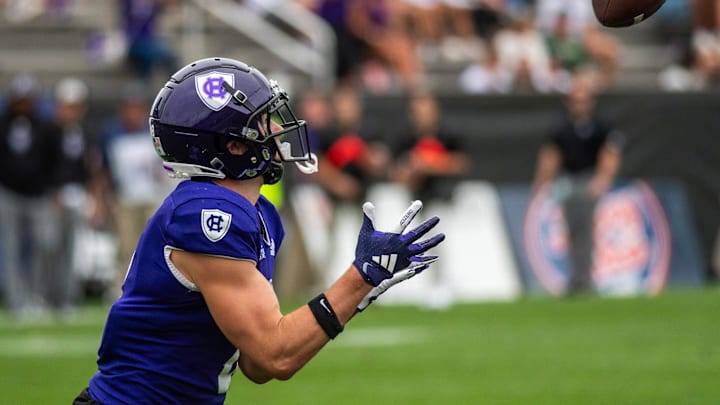 Holy Cross wide receiver Charly Mullaly catches a 45-yard pass from quarterback Joe Pesansky in the second quarter at Fitton Field Saturday.