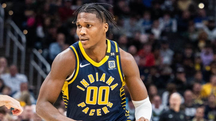 Jan 3, 2024; Indianapolis, Indiana, USA; Indiana Pacers guard Bennedict Mathurin (00) dribbles the ball while  defends in the second half at Gainbridge Fieldhouse. Mandatory Credit: Trevor Ruszkowski-USA TODAY Sports