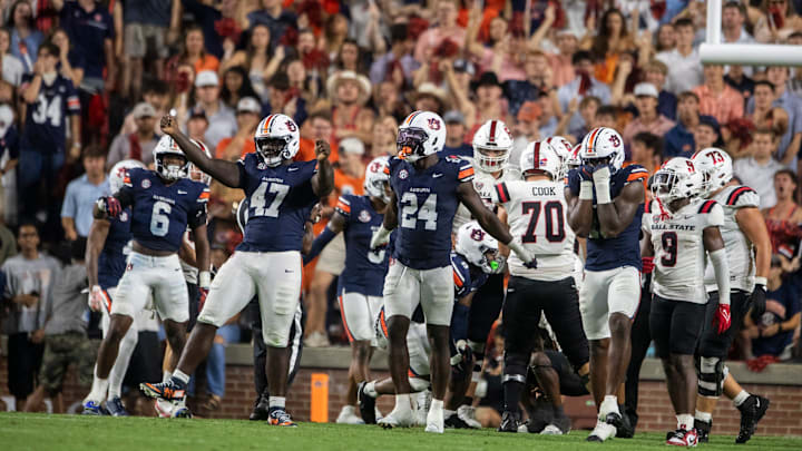 Auburn Tigers defensive lineman Malik Blocton (47) and his teammates celebrate his defensive stop as Auburn Tigers take on Ball State Cardinals at Jordan-Hare Stadium in Auburn, Ala. on Saturday, Sept. 6, 2025. Auburn Tigers defeated Ball State Cardinals 42-3. Auburn Tigers defensive lineman Malik Blocton (47) and his teammates celebrate his defensive stop as Auburn Tigers take on Ball State Cardinals at Jordan-Hare Stadium in Auburn, Ala. on Saturday, Sept. 6, 2025. Auburn Tigers defeated Ball State Cardinals 42-3.