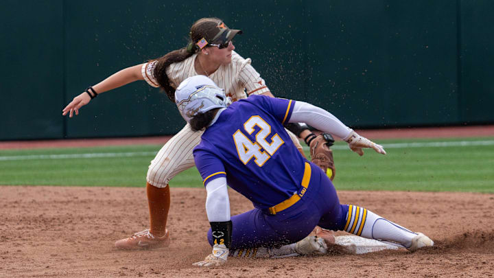 Texas utility Leighann Goode (43) attempts to tag out LSU utility Tori Edwards (42) during the game against LSU at Red & Charline McCombs Field on Thursday, April 17, 2025 in Austin.