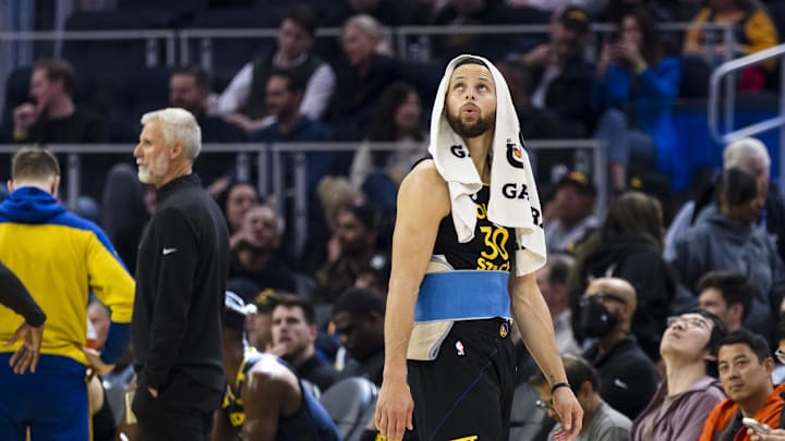 Golden State Warriors guard Curry watches a replay during a review of call during the first quarter against the Toronto Raptors at Chase Center. 
