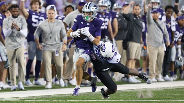 Oct 21, 2023; Manhattan, Kansas, USA; Kansas State Wildcats wide receiver Jayce Brown (1) is tackled by TCU Horned Frogs safety Mark Perry (3) during the second quarter at Bill Snyder Family Football Stadium. Mandatory Credit: Scott Sewell-USA TODAY Sports