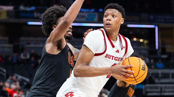 Mar 12, 2025; Indianapolis, IN, USA;  Rutgers Scarlet Knights guard Ace Bailey (4) shoots the ball while USC Trojans guard Kevin Patton Jr. (8) defends in the second half at Gainbridge Fieldhouse. Mandatory Credit: Trevor Ruszkowski-Imagn Images