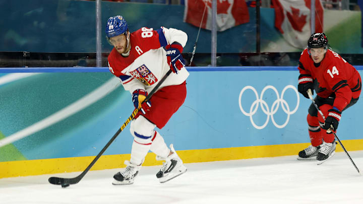 Feb 18, 2026; Milan, Italy; David Pastrnak of Czechia controls the puck against Canada in a men's ice hockey quarterfinal during the Milano Cortina 2026 Olympic Winter Games at Milano Santagiulia Ice Hockey Arena. Mandatory Credit: Geoff Burke-Imagn Images