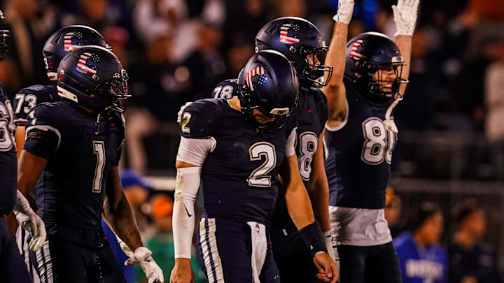 Nov 8, 2025; East Hartford, Connecticut, USA; UConn Huskies quarterback Joe Fagnano (2) with teammates after running the ball for a two point conversion against the Duke Blue Devils in the second half at Pratt & Whitney Stadium at Rentschler Field. Mandatory Credit: David Butler II-Imagn Images
