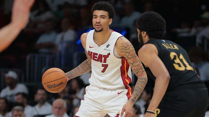Apr 26, 2025; Miami, Florida, USA; Miami Heat center Kel'el Ware (7) dribbles the basketball as Cleveland Cavaliers center Jarrett Allen (31) defends in the third quarter during game three for the first round of the 2025 NBA Playoffs at Kaseya Center. Mandatory Credit: Sam Navarro-Imagn Images Apr 26, 2025; Miami, Florida, USA; Miami Heat center Kel'el Ware (7) dribbles the basketball as Cleveland Cavaliers center Jarrett Allen (31) defends in the third quarter during game three for the first round of the 2025 NBA Playoffs at Kaseya Center. Mandatory Credit: Sam Navarro-Imagn Images