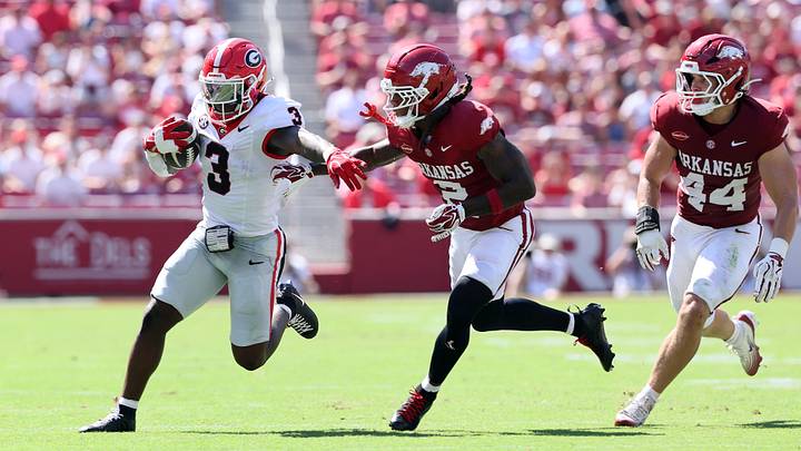 Sep 19, 2026; Fayetteville, Arkansas, USA; Georgia Bulldogs running back Nate Frazier (3) runs with the ball against the Georgia Bulldogs Arkansas Razorbacks defensive back Shelton Lewis (2) during the first half at Donald W. Reynolds Razorback Stadium. Mandatory Credit: Nelson Chenault-Imagn Images Sep 19, 2026; Fayetteville, Arkansas, USA; Georgia Bulldogs running back Nate Frazier (3) runs with the ball against the Georgia Bulldogs Arkansas Razorbacks defensive back Shelton Lewis (2) during the first half at Donald W. Reynolds Razorback Stadium. Mandatory Credit: Nelson Chenault-Imagn Images
