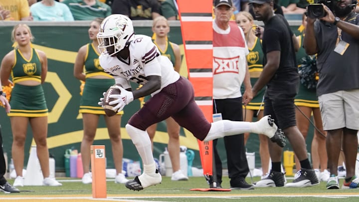 Sep 2, 2023; Waco, Texas, USA; Texas State Bobcats running back Ismail Mahdi (21) goes in for the 10-yard touchdown catch Baylor Bears during the first half at McLane Stadium. Mandatory Credit: Raymond Carlin III-Imagn Images