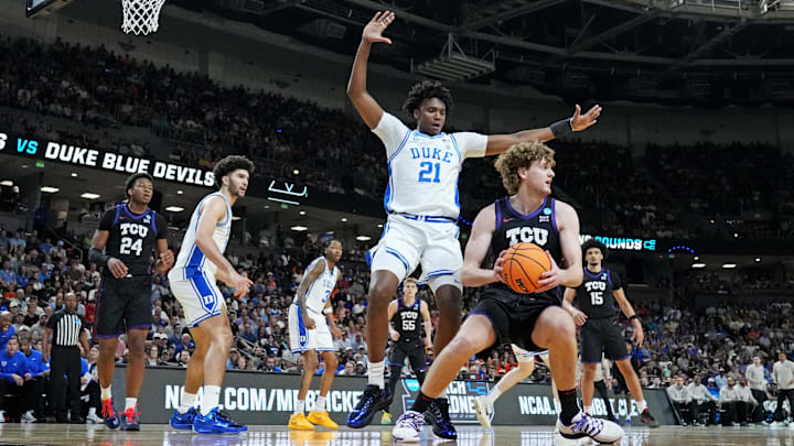 Mar 21, 2026; Greenville, SC, USA; Texas Christian University Horned Frogs guard Liutauras Lelevicius (3) drives against Duke Blue Devils center Patrick Ngongba (21) during the 2026 NCAA Tournament.