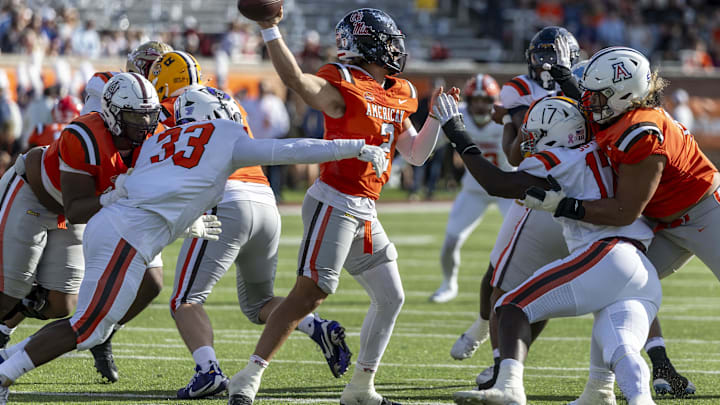 Feb 1, 2025; Mobile, AL, USA; National team defensive lineman David Walker of Central Arkansas (33) and National team defensive lineman Jah Joyner of Minnesota (17) pressures American team quarterback Jaxson Dart of Ole Miss (2) during the first half of the 2025 Senior Bowl football game at Hancock Whitney Stadium. Mandatory Credit: Vasha Hunt-Imagn Images Feb 1, 2025; Mobile, AL, USA; National team defensive lineman David Walker of Central Arkansas (33) and National team defensive lineman Jah Joyner of Minnesota (17) pressures American team quarterback Jaxson Dart of Ole Miss (2) during the first half of the 2025 Senior Bowl football game at Hancock Whitney Stadium. Mandatory Credit: Vasha Hunt-Imagn Images