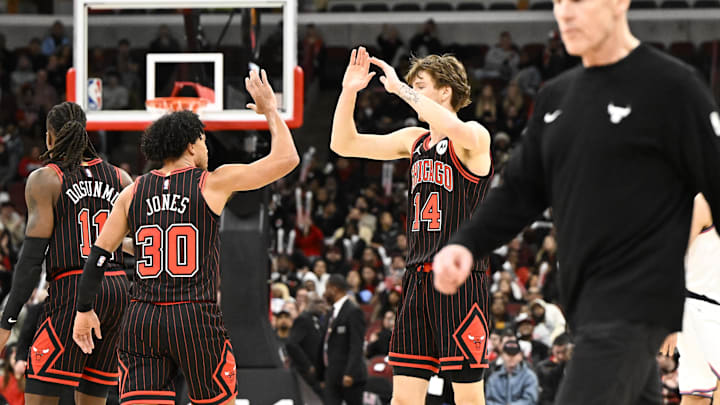 Jan 20, 2026; Chicago, Illinois, USA; Chicago Bulls forward Matas Buzelis (14) and  guard Tre Jones (30) high five during the second half against the LA Clippers at United Center. Mandatory Credit: Matt Marton-Imagn Images