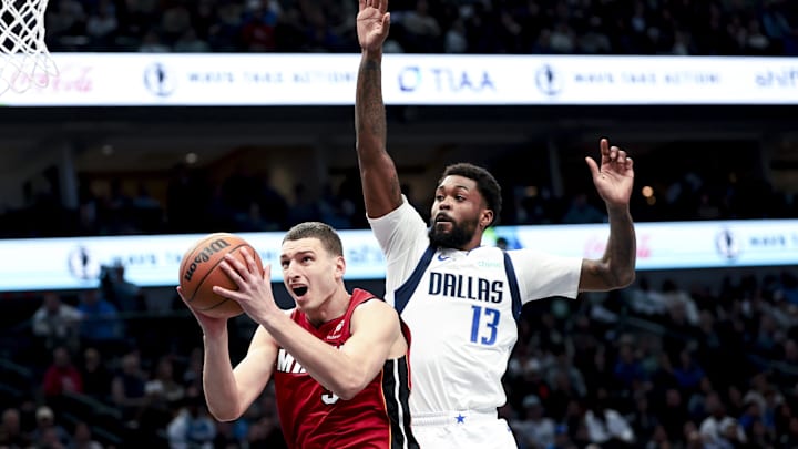 Feb 13, 2025; Dallas, Texas, USA; Miami Heat forward Nikola Jovic (5) shoots past Dallas Mavericks forward Naji Marshall (13) during the second half at American Airlines Center. Mandatory Credit: Kevin Jairaj-Imagn Images Feb 13, 2025; Dallas, Texas, USA; Miami Heat forward Nikola Jovic (5) shoots past Dallas Mavericks forward Naji Marshall (13) during the second half at American Airlines Center. Mandatory Credit: Kevin Jairaj-Imagn Images
