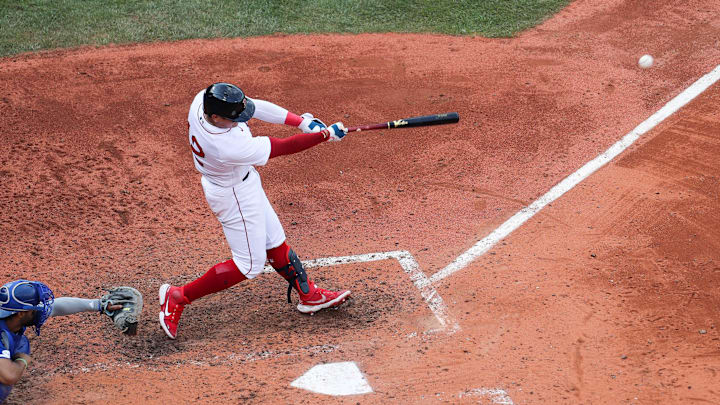 Boston, Massachusetts, USA; Boston Red Sox second baseman Yu Chang (12) hits an RBI during the sixth inning against the Kansas City Royals at Fenway Park.